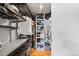 Organized walk-in closet with shelving, storage, and wood floors at 1090 N Lafayette St # 503, Denver, CO 80218