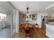 Bright dining area with hardwood floors and modern lighting, located near the kitchen and balcony access at 1090 N Lafayette St # 503, Denver, CO 80218