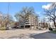 Multi-story apartment building with balconies and mature trees, offering a serene urban living experience at 1090 N Lafayette St # 503, Denver, CO 80218