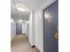 Well-lit hallway with neutral carpeting leads to apartment entrances, offering a secure residential environment at 1090 N Lafayette St # 503, Denver, CO 80218