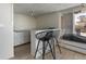 Modern kitchenette with white cabinets, breakfast bar, and barstool seating, perfect for casual dining at 1090 N Lafayette St # 503, Denver, CO 80218