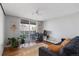 Welcoming living room with hardwood floors, desk and balcony access at 1090 N Lafayette St # 503, Denver, CO 80218