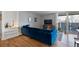 Stylish living area features hardwood floors, modern furniture, and sliding door access to balcony at 1090 N Lafayette St # 503, Denver, CO 80218