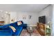 Comfortable living room featuring a plush blue sectional sofa and sleek modern furnishings at 1090 N Lafayette St # 503, Denver, CO 80218