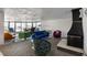 Bright living room featuring plush carpet, modern fireplace, and expansive windows with city views at 1090 N Lafayette St # 503, Denver, CO 80218