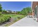 Expansive backyard with lush greenery, including artificial turf, surrounded by wooden fencing and mature trees at 18874 E Colorado Dr, Aurora, CO 80017