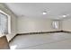 Unfinished basement area with exposed foundation, ready for customization and featuring natural light from windows at 18874 E Colorado Dr, Aurora, CO 80017