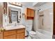 Full bathroom featuring a single sink vanity, medicine cabinet, and shower over tub at 18874 E Colorado Dr, Aurora, CO 80017