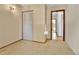 This bedroom features a large closet, neutral carpet, and access to additional rooms through a connecting door at 18874 E Colorado Dr, Aurora, CO 80017