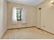 Vacant bedroom with a window and neutral carpet at 18874 E Colorado Dr, Aurora, CO 80017