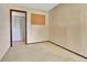 Small bedroom with a closet and a bulletin board at 18874 E Colorado Dr, Aurora, CO 80017