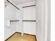 Walk-in closet with shelves and rods for organized storage at 18874 E Colorado Dr, Aurora, CO 80017