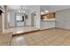 Well-lit dining room adjacent to the kitchen with a modern light fixture and large window at 18874 E Colorado Dr, Aurora, CO 80017