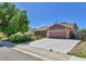 View of the house and driveway showcasing its exterior, landscaping, and overall curb appeal at 18874 E Colorado Dr, Aurora, CO 80017