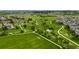 Community aerial view with lush green spaces, walking trails, and a soccer field, ideal for an active lifestyle at 23421 E Rockinghorse Pkwy, Aurora, CO 80016