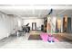 Finished basement featuring exercise equipment and recreational space, offering versatility for different uses at 23421 E Rockinghorse Pkwy, Aurora, CO 80016