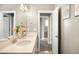 Clean bathroom featuring a double vanity with modern fixtures and framed mirror at 23421 E Rockinghorse Pkwy, Aurora, CO 80016