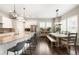 Bright, open kitchen featuring granite countertops, stainless steel appliances, and bar seating at 23421 E Rockinghorse Pkwy, Aurora, CO 80016