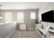 Cozy upstairs loft area with built-in bookshelves and storage, plus comfortable seating at 23421 E Rockinghorse Pkwy, Aurora, CO 80016