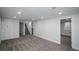 Finished basement with neutral carpet, recessed lights, and a built-in storage unit at 1809 W Crestline Dr, Littleton, CO 80120