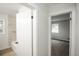 Bright bathroom featuring a tiled shower-tub combo and an adjacent bedroom through an open door at 1809 W Crestline Dr, Littleton, CO 80120