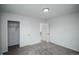 Bedroom with an open closet, neutral carpet, and access to an adjacent room at 1809 W Crestline Dr, Littleton, CO 80120