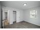 Bedroom with carpet, closet, window, and an open door to an adjacent room at 1809 W Crestline Dr, Littleton, CO 80120