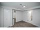 Cozy bedroom featuring neutral carpet, white walls, and ample closet space, providing a serene and comfortable retreat at 1809 W Crestline Dr, Littleton, CO 80120