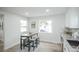 Bright dining area next to kitchen with a modern table set and ample natural light at 1809 W Crestline Dr, Littleton, CO 80120