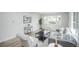 Bright living room showcasing modern decor, large windows, and comfortable seating at 1809 W Crestline Dr, Littleton, CO 80120