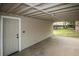 Covered patio with neutral siding, perfect for outdoor gatherings and relaxation, offering protection from the elements at 1809 W Crestline Dr, Littleton, CO 80120
