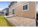 Exterior featuring a spacious backyard with a patio and a well-maintained lawn at 20145 E Fair Ln, Centennial, CO 80016