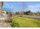 Backyard view with grass area, landscaping, and a grill on the patio at 20145 E Fair Ln, Centennial, CO 80016