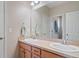 Bathroom featuring double sinks with a large mirror and neutral color scheme at 20145 E Fair Ln, Centennial, CO 80016