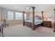 Bedroom with four-poster bed, ceiling fan, and carpet at 20145 E Fair Ln, Centennial, CO 80016