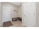 Traditional entryway with tile floors, bench, and white doors at 20145 E Fair Ln, Centennial, CO 80016