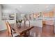 Open concept kitchen and dining room with hardwood floors and staircase at 20145 E Fair Ln, Centennial, CO 80016