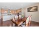 Open concept kitchen and dining room with hardwood floors and stainless steel appliances at 20145 E Fair Ln, Centennial, CO 80016