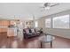 Open-concept living space with hardwood floors, a view of the kitchen, and ample natural light at 20145 E Fair Ln, Centennial, CO 80016