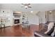 Elegant living room with hardwood floors, fireplace, and built-in shelves, creating a cozy atmosphere at 20145 E Fair Ln, Centennial, CO 80016