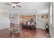 Spacious living area with hardwood floors open to kitchen with granite countertops at 20145 E Fair Ln, Centennial, CO 80016