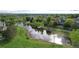 Picturesque pond with walking trails and lush greenery, offering a serene natural escape within the community at 20145 E Fair Ln, Centennial, CO 80016