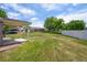 A large, well-maintained backyard with lush green grass and mature trees for shade and privacy at 9214 Winona Ct, Westminster, CO 80031