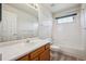 Clean bathroom with a tub and shower combination and a single sink vanity at 9214 Winona Ct, Westminster, CO 80031