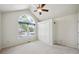 Bright bedroom with vaulted ceiling, large window, neutral carpet, and a closet at 9214 Winona Ct, Westminster, CO 80031