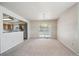 Bright dining area featuring sliding glass doors and an open view of the kitchen at 9214 Winona Ct, Westminster, CO 80031