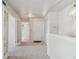 Bright entryway featuring fresh paint and plush carpeting at 9214 Winona Ct, Westminster, CO 80031