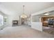 Inviting living space with fireplace, kitchen access, and lots of natural light at 9214 Winona Ct, Westminster, CO 80031