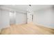 An empty bedroom with light wood floors and plenty of potential at 1401 Ash St, Denver, CO 80220