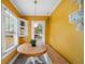 Bright breakfast nook with custom seating, a built-in shelf, and lots of natural light at 1401 Ash St, Denver, CO 80220